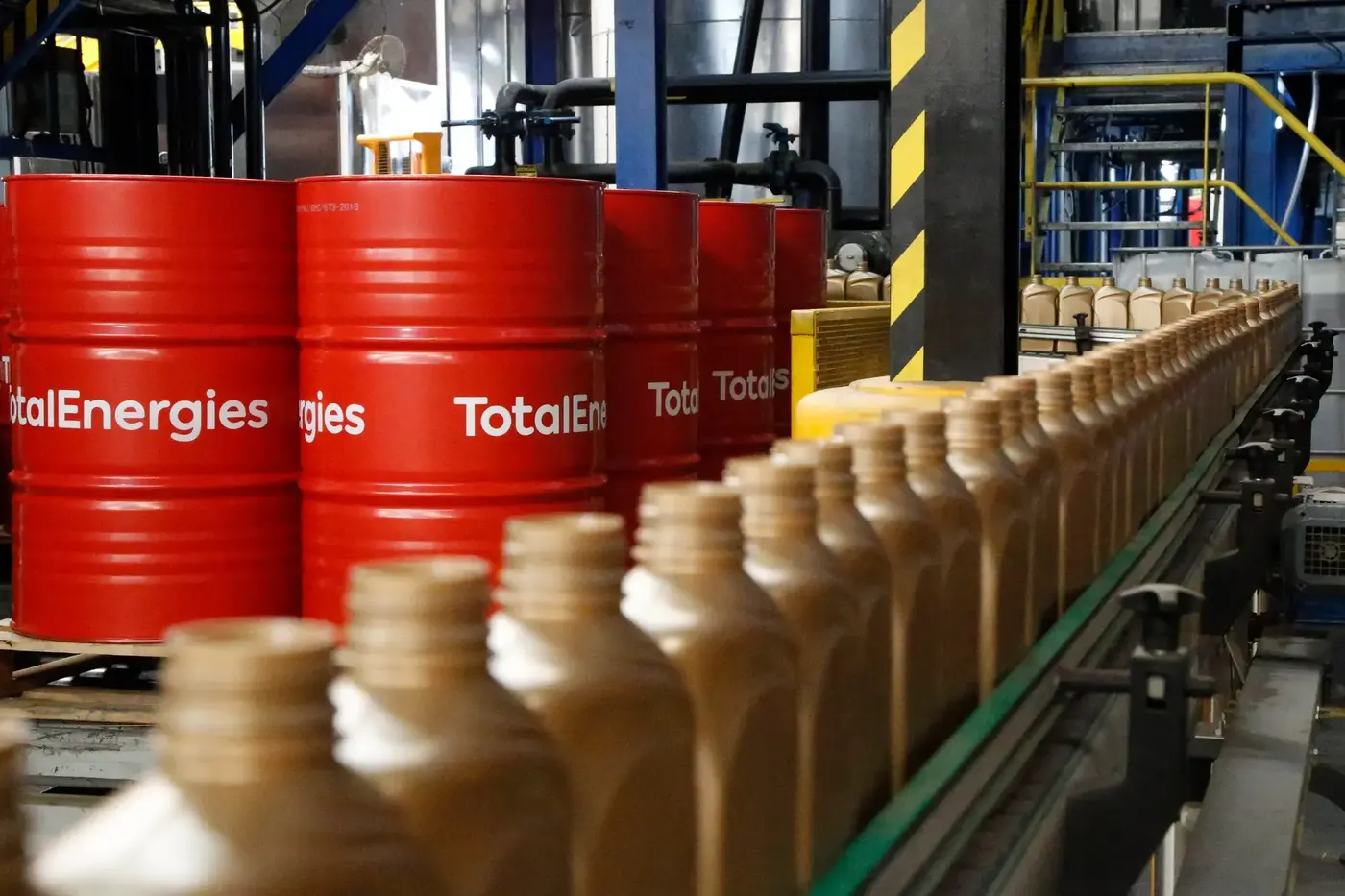 TotalEnergies drums and bottles on a lubricant production line